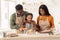 African American Family Baking Cookies, Daughter Kneading Dough In Kitchen