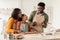 African American Family Baking Using Forms Making Cookies In Kitchen