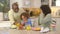 African American family  being silly with food in kitchen