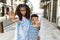 African american family of bother and sister standing at the street with open hand doing stop sign with serious and confident