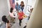 African American  family celebrating Independence Day arriving for a house party with relatives,elevated view