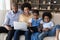 African American family engaged in digital gadgets using