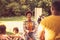 African American family having fun outdoors. Focus is on background