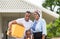 African american family with luggage and carrying boxes into new home, Happiness family on moving day concepts