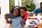 African American family taking a selfie in the garden