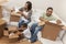 African American Family Unpacking Boxes Moving House