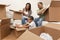 African American Family Unpacking Moving Boxes