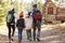 African American Family Walking Through Fall Woodland