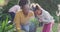 African american family working in garden on sunny day