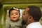 African American father holding his daughter.