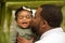 African American father holding his daughter.