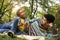 African American father in meadow with daughter.