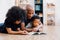 African American father reading a fairy tale fable story for kid