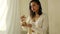 African-American female doing sound meditation with a singing bowl.