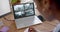 African american female security officer watching business cctv camera views on laptop, slow motion