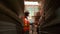 African American female worker inspects stock order at paper factory warehouse.