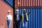 African american foreman is explaining the various sections of the container depot terminal to a caucasian man manager, with a
