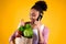 African American girl with groceries bags isolated
