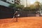 African-American girl playing tennis