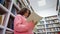 African American girl reading in library