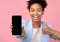 African american girl showing blank cellphone screen