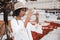 African-American girl taking photos on street via cell phone