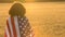African American girl teenager female young woman wrapped in an American US Stars and Stripes flag