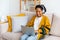 African american girl using laptop at home office looking at screen typing chatting reading writing email. Young woman