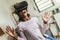 African American girl using virtual reality glasses in her room.