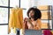 African American girls offer and sell clothes online via live streaming, internet shopping,