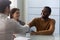 African American husband handshake close deal with realtor