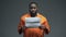 African-american imprisoned male holding Punishment sign in cell, human rights