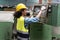 african american Industry engineer woman inspect control cabinet machine in industrial factory . black female mechanical