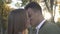 African American kisses his Caucasian girlfriend