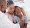 African american male paediatrician examining sick boy with stethoscope during visit with mom. Doctor checking heart