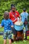 African American male percussionist playing rhythm with his djembe drum bongo