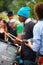 African American male playing rhythm on a drum at Tam Tams festival in Mount Royal Park