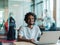 An African-American male, utilizing adaptive technology in his wheelchair, seamlessly integrates into a modern office