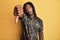 African american man with braids wearing leopard animal print shirt looking unhappy and angry showing rejection and negative with