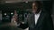 African American man businessman male entrepreneur talking speaking on video conference using mobile phone in dark