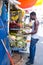 African American man buys coconuts