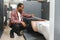 African american Man choosing home toilet in store