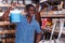 African-American man choosing materials for overhauls in building materials store