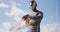 African american man drinking water while exercising in countryside checking his watch