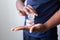 African american man holds mineral facial powder for perfect make-up for women - male make-up artist and cosmetic