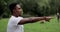 African american man limbering-up and stretching legs after running jog workout. Runner stretching and warming-up before