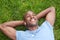 African American man lying in grass