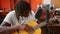 African american man musician playing classical guitar at music studio