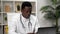 African American man online doctor talking to patient video call webcam laptop