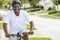 African American Man Riding Bicycle